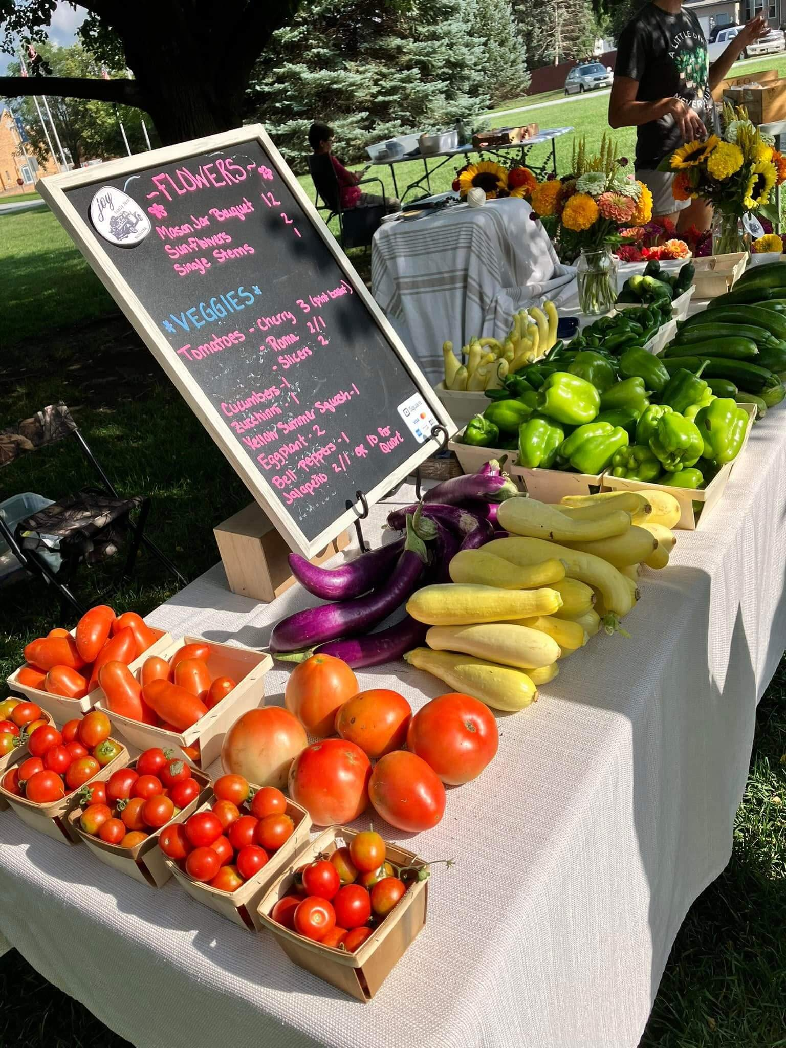 Vendor table full of produce at Wayne Farmers Market